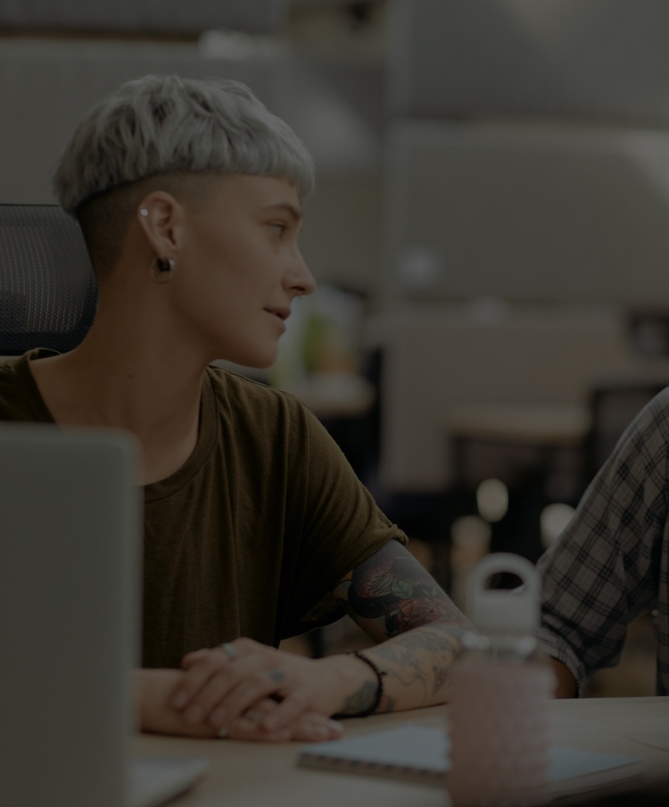 Man and woman talking to each other in office