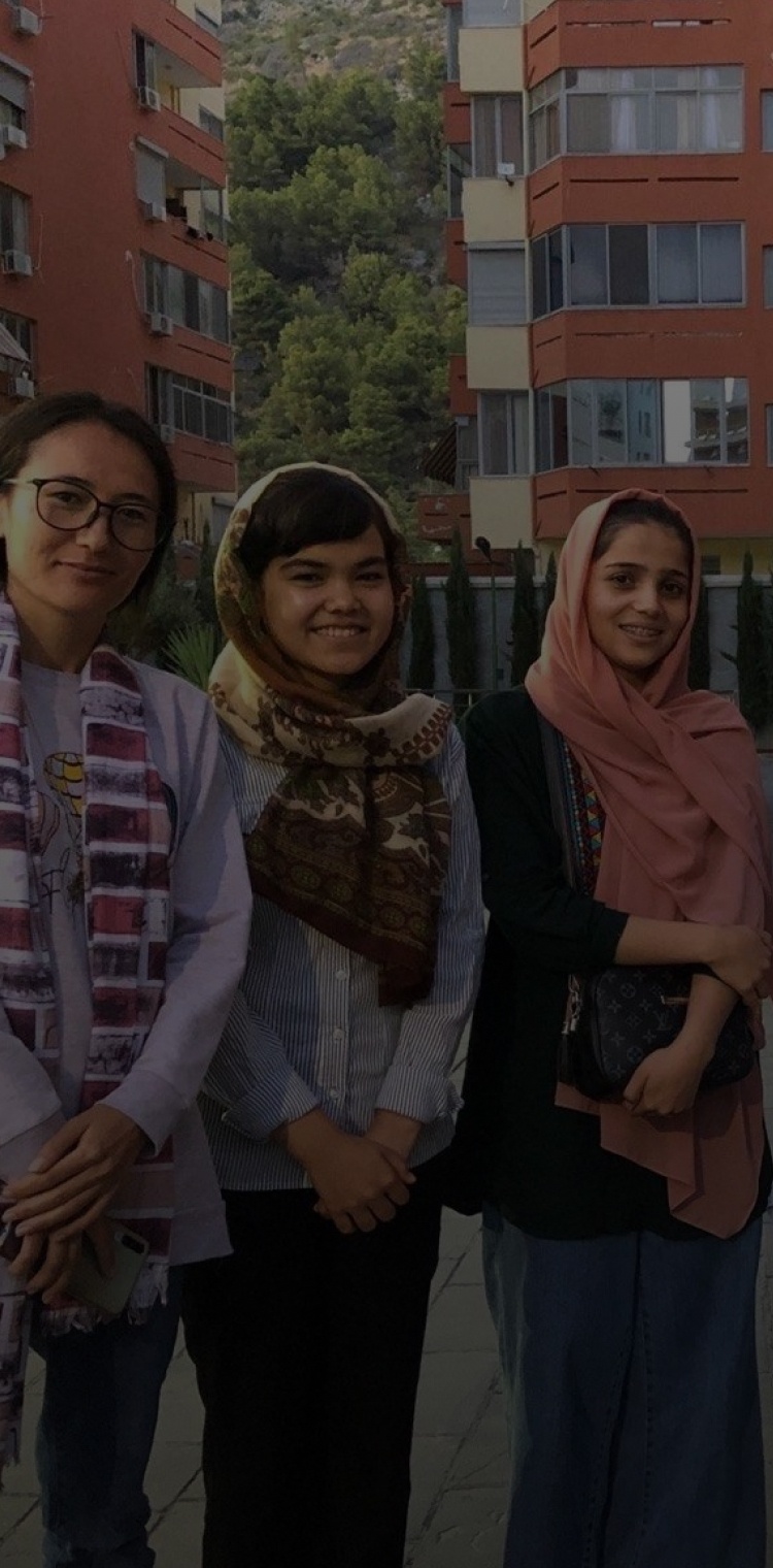 Group of women with headscarves posing for camera